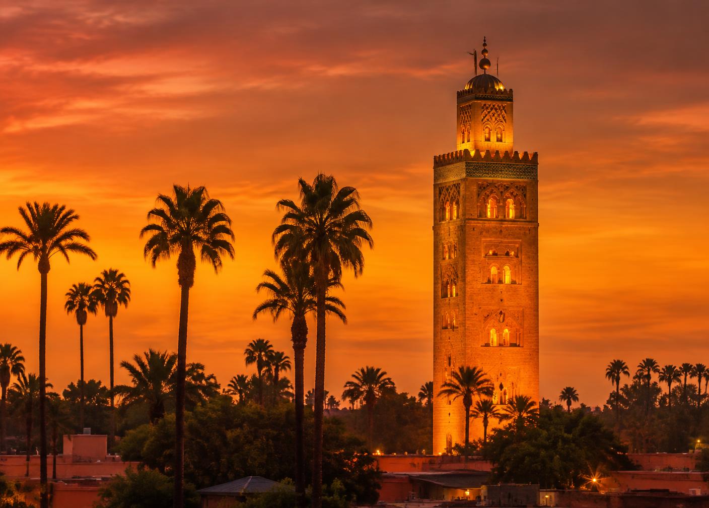 The Koutoubia minaret in Marrakech lit gold at dusk